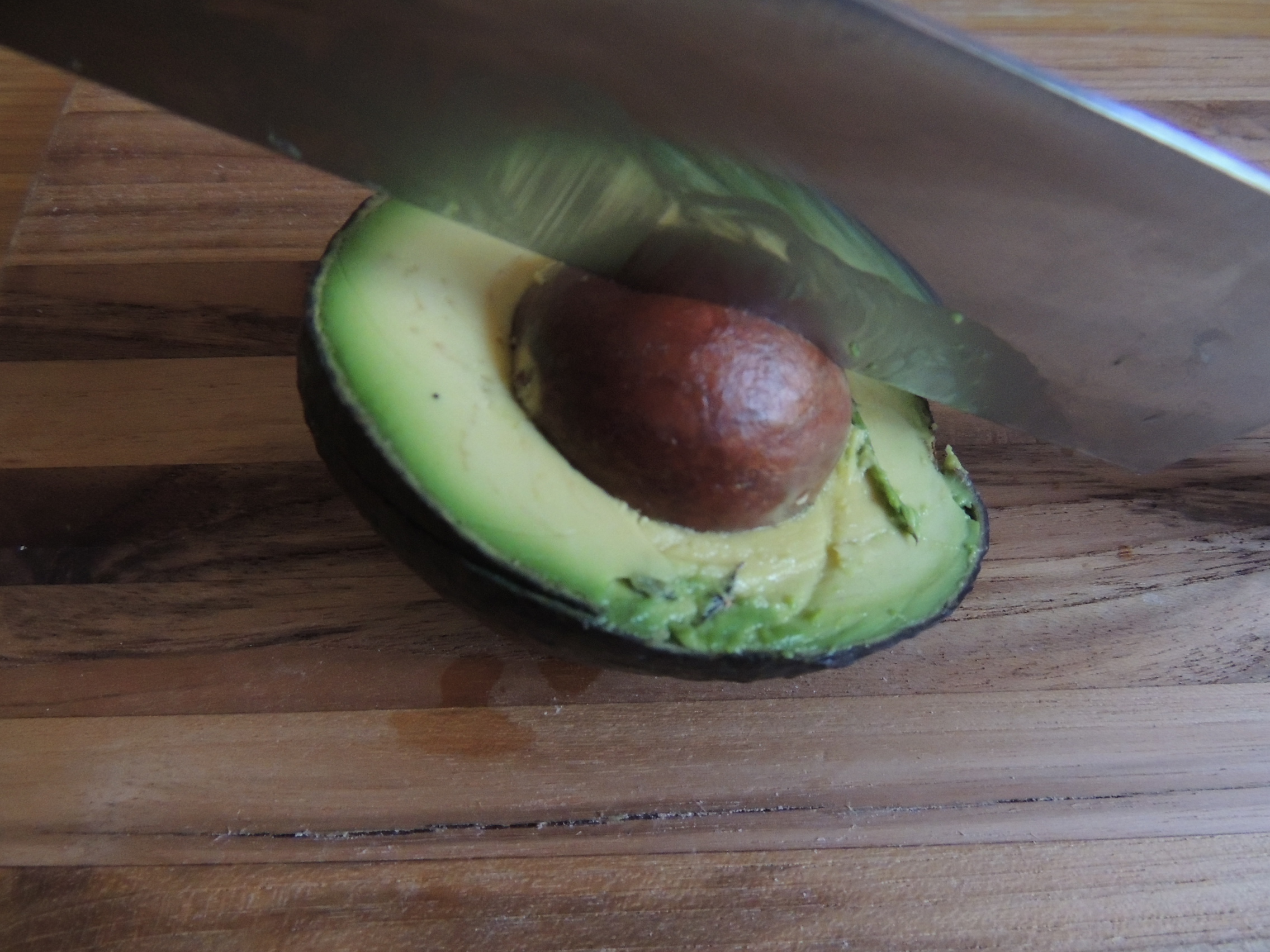 Knife in an avocado pit
