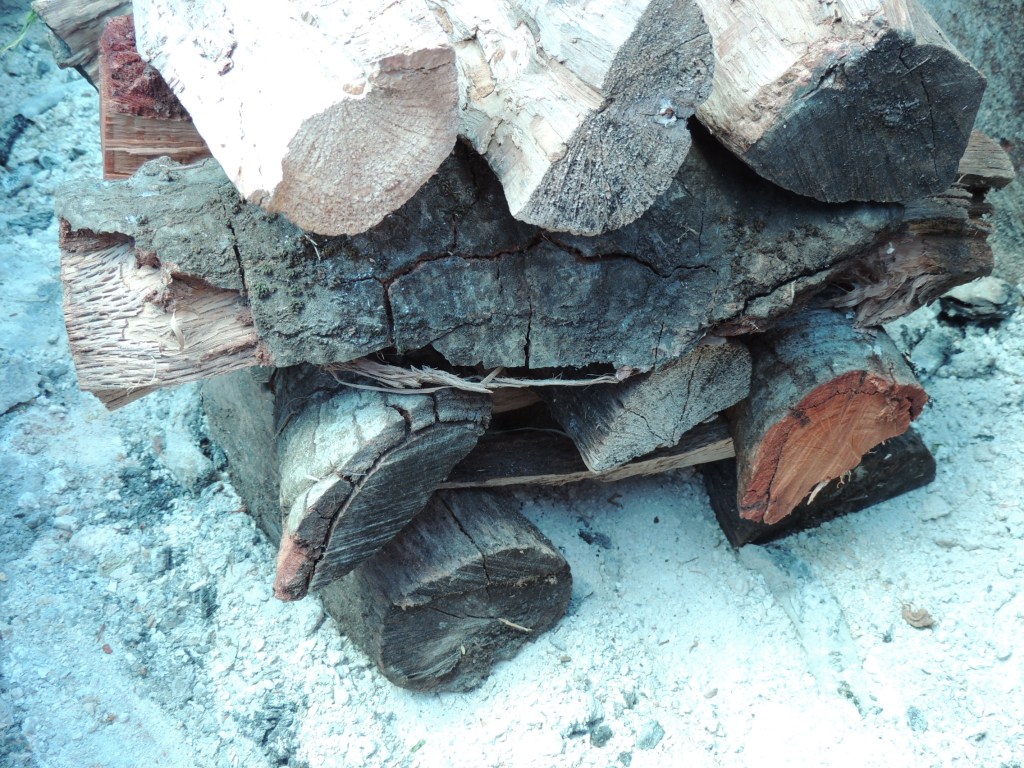 Oak wood stacked like Lincoln logs for Paella