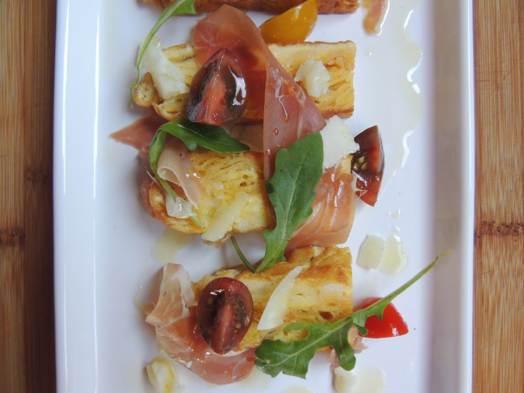 Spanish Tortilla with Prosciutto tomato, arugula and manchego